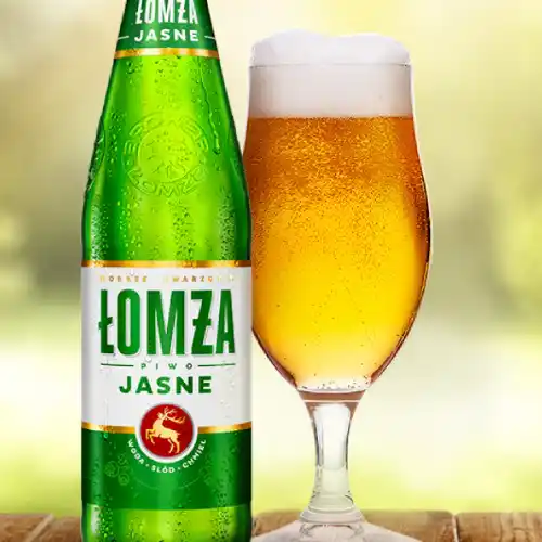 Bottle and glass of Łomża Jasne Polish lager at Relax in Greenpoint